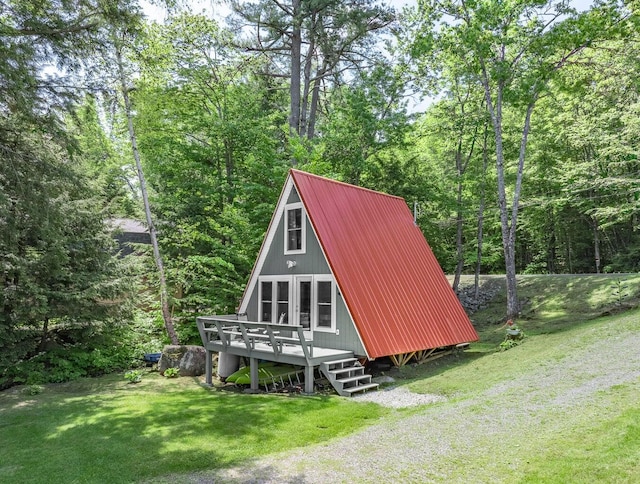 view of outbuilding with a yard