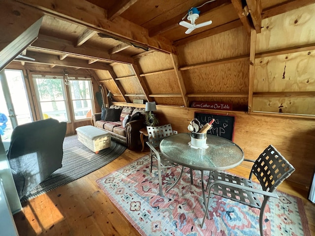 sitting room with hardwood / wood-style flooring, ceiling fan, and lofted ceiling