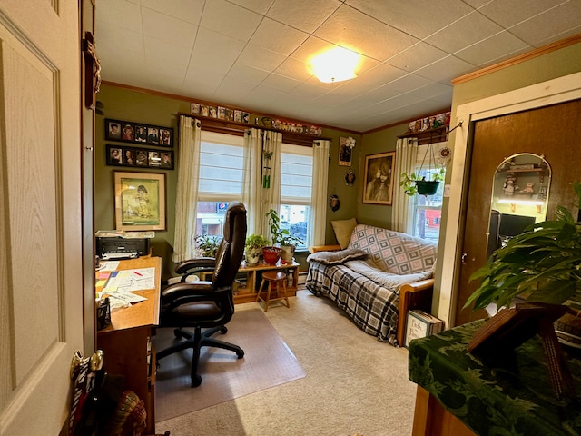 carpeted home office with crown molding