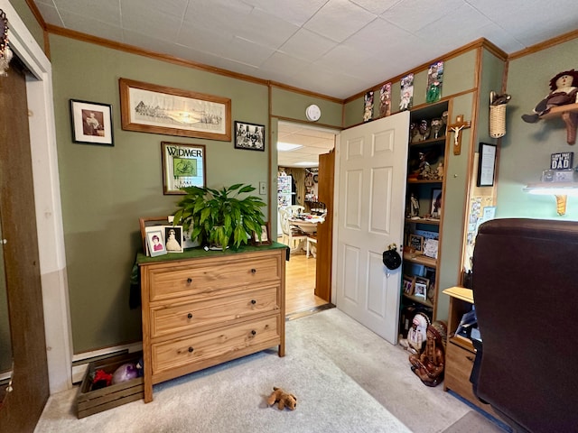 carpeted bedroom featuring crown molding