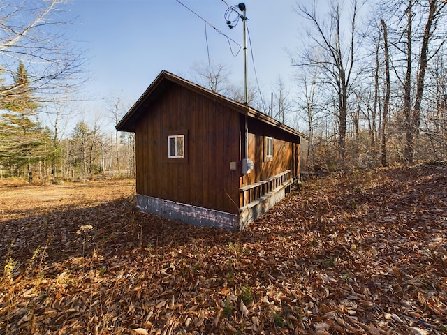 view of property exterior featuring an outdoor structure