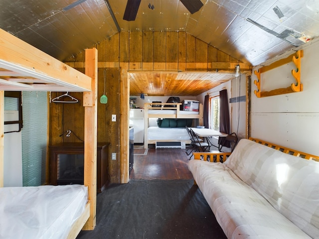 bedroom with vaulted ceiling and wood-type flooring