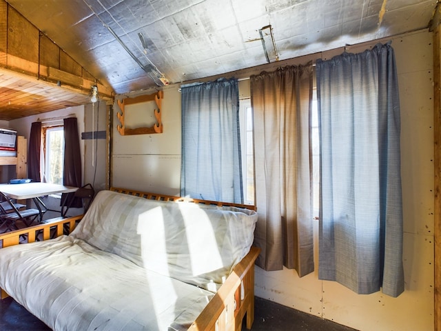 unfurnished bedroom with vaulted ceiling