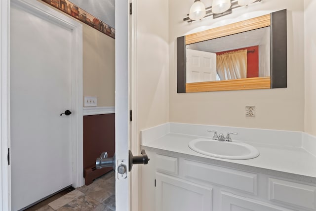 bathroom featuring vanity and a baseboard radiator