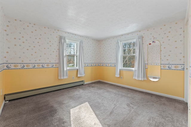 unfurnished room with carpet flooring and a baseboard radiator