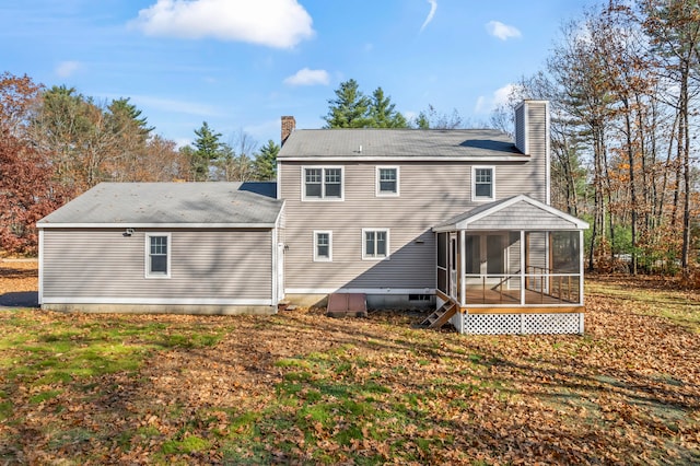 back of house featuring a sunroom