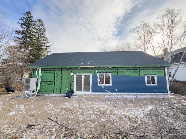 rear view of house with ac unit