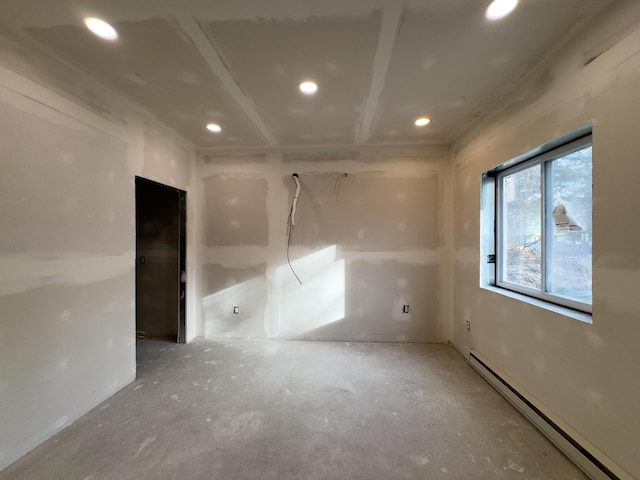 empty room featuring a baseboard heating unit