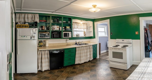 kitchen with open shelves, light countertops, a sink, white appliances, and green cabinetry