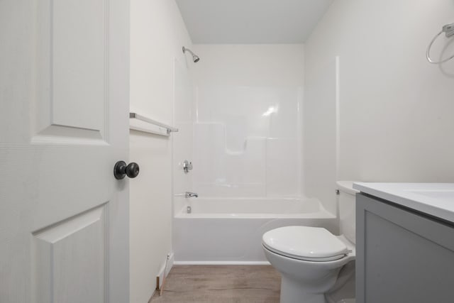 full bathroom with wood-type flooring, vanity, toilet, and shower / bathtub combination