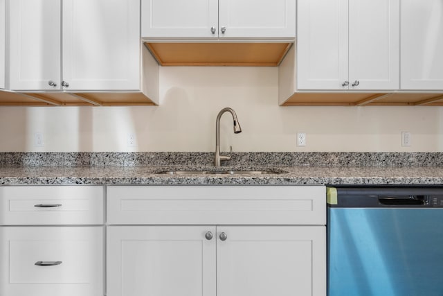 kitchen with white cabinetry, sink, light stone counters, and dishwasher