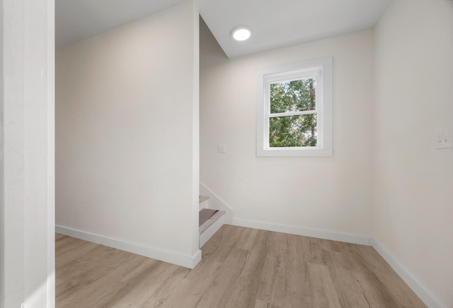 staircase with wood-type flooring