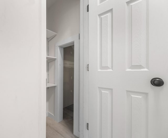 corridor featuring light hardwood / wood-style floors