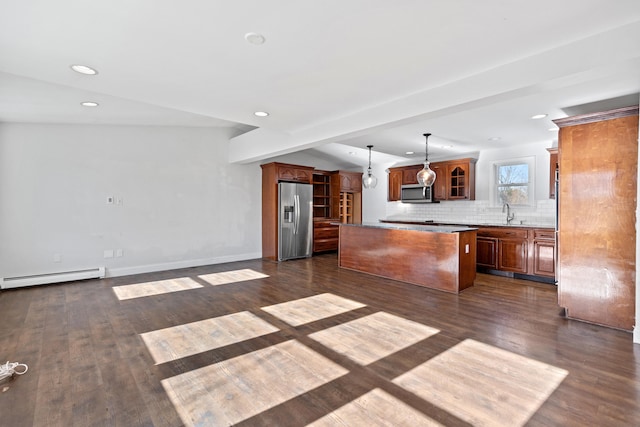 kitchen featuring a center island, stainless steel appliances, a baseboard heating unit, vaulted ceiling with beams, and hanging light fixtures