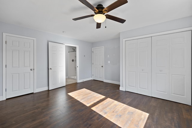 unfurnished bedroom with dark hardwood / wood-style flooring and ceiling fan