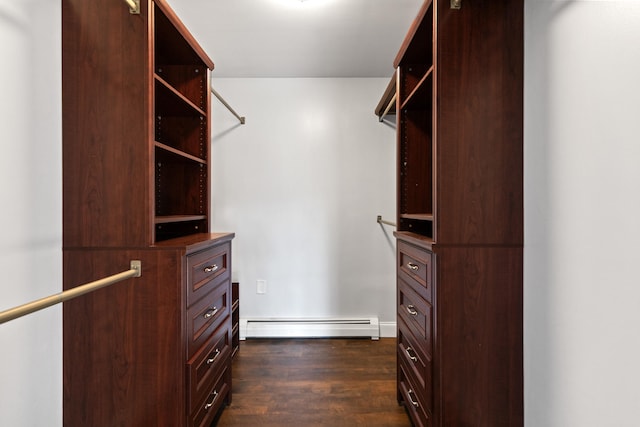 walk in closet with dark hardwood / wood-style flooring and a baseboard radiator