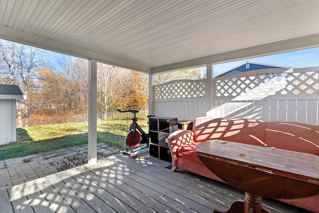 wooden terrace with a yard