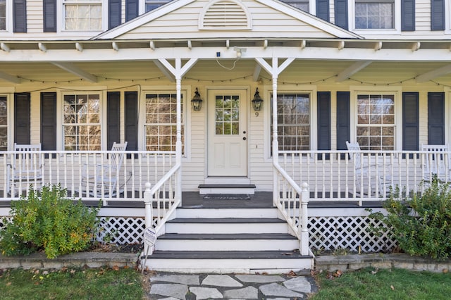 doorway to property with a porch