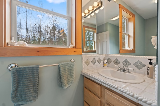 bathroom with vanity and backsplash