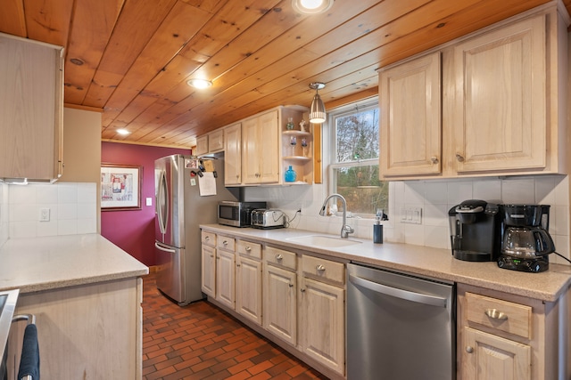 kitchen featuring sink, stainless steel appliances, tasteful backsplash, and wood ceiling