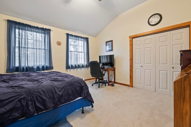 bedroom featuring carpet flooring, a closet, and vaulted ceiling