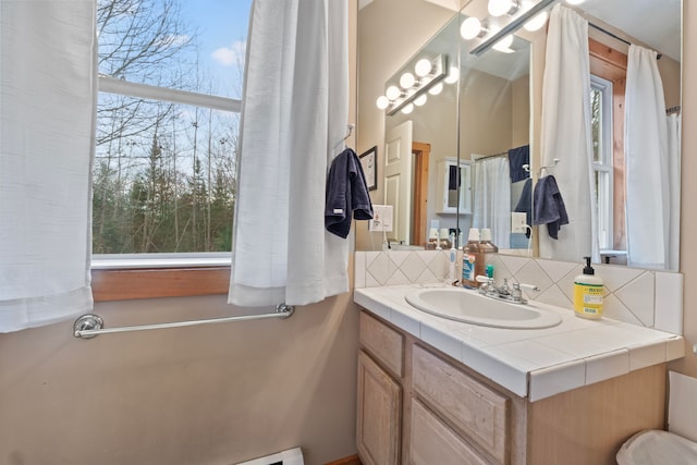 bathroom featuring tasteful backsplash and vanity