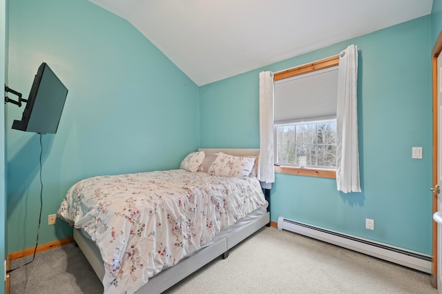 bedroom with lofted ceiling, carpet floors, and a baseboard heating unit