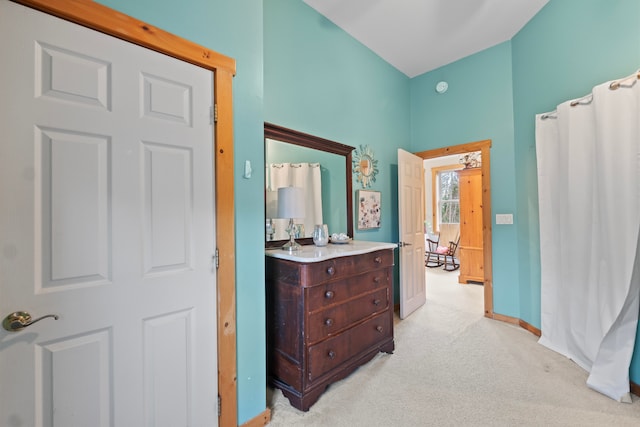 hallway with light colored carpet