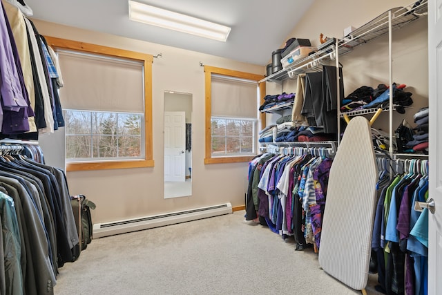 walk in closet featuring baseboard heating and carpet