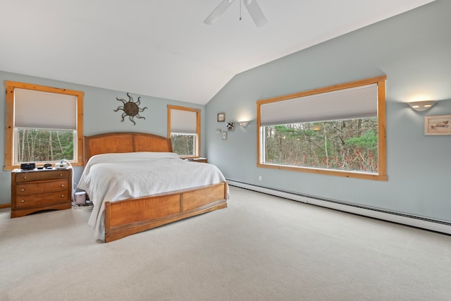 carpeted bedroom featuring vaulted ceiling, ceiling fan, and a baseboard heating unit