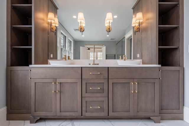 bathroom with vanity and built in shelves