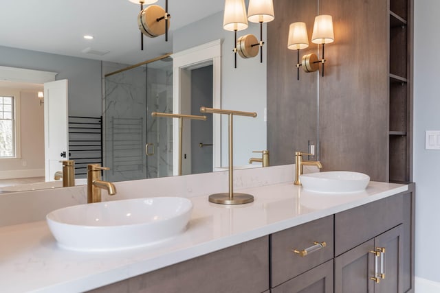 bathroom featuring vanity and a shower with door