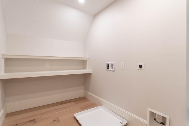 laundry area with hookup for an electric dryer, light hardwood / wood-style floors, and hookup for a washing machine