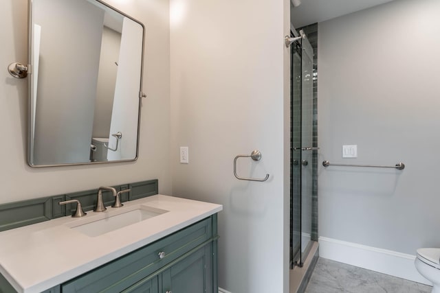 bathroom featuring walk in shower, vanity, and toilet