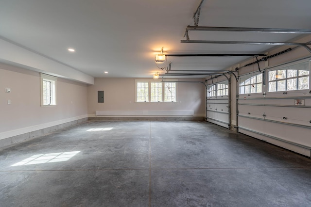 garage featuring a garage door opener and electric panel