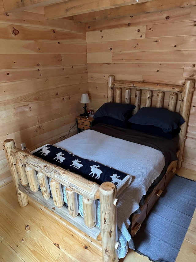 bedroom with wooden walls