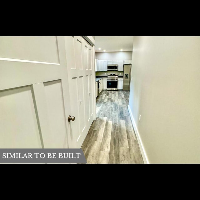 hallway featuring light hardwood / wood-style flooring