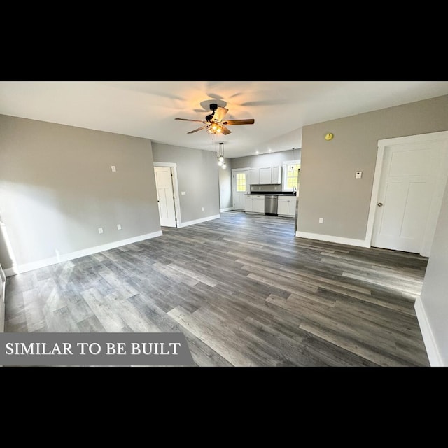 unfurnished living room featuring ceiling fan and dark wood-type flooring