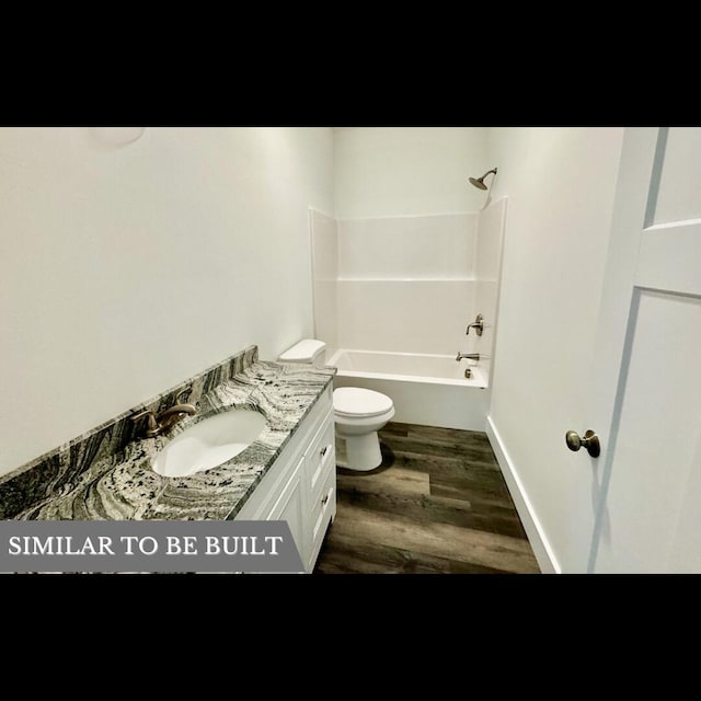 full bathroom featuring hardwood / wood-style floors, vanity, toilet, and bathtub / shower combination