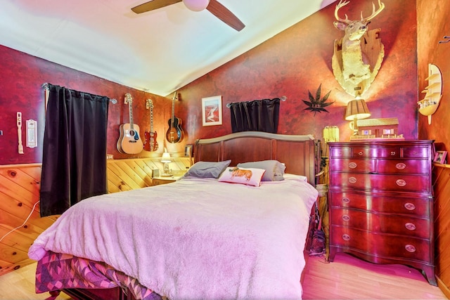 bedroom featuring ceiling fan, lofted ceiling, and light hardwood / wood-style floors