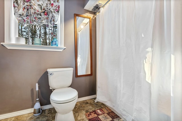 bathroom featuring toilet