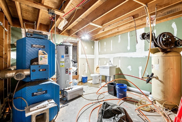 basement featuring sink and water heater