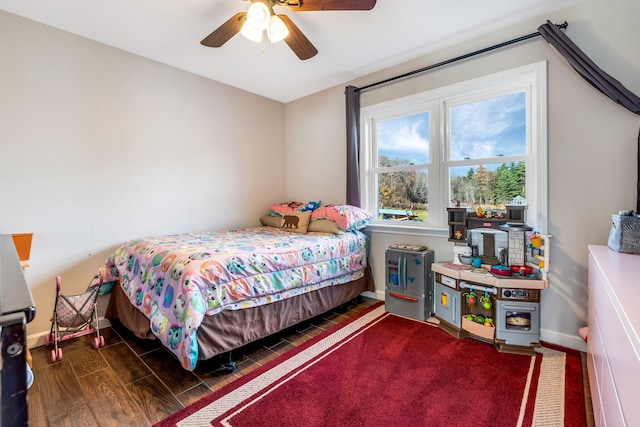 bedroom featuring dark wood-type flooring and ceiling fan