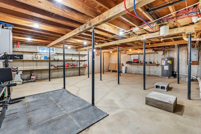 basement with electric water heater and electric panel