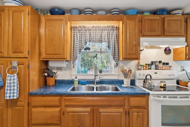 kitchen featuring white range with electric stovetop and sink