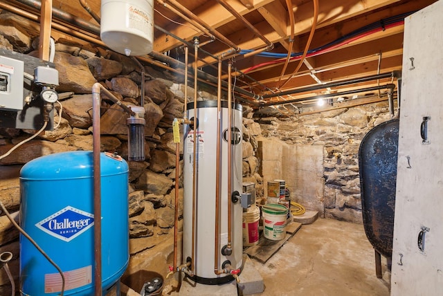 utility room featuring water heater