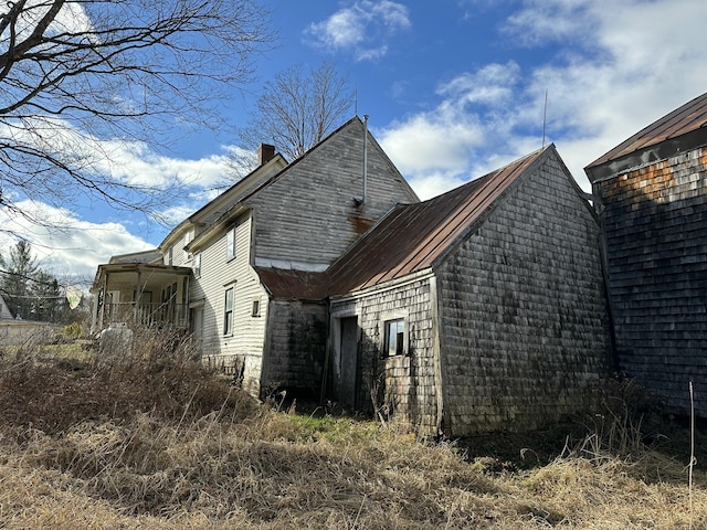 view of home's exterior with a chimney