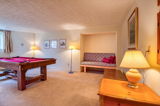 game room featuring carpet and a textured ceiling