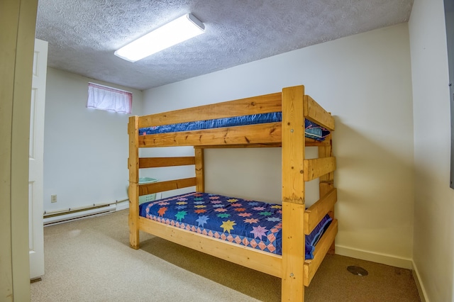 carpeted bedroom with a textured ceiling and a baseboard radiator