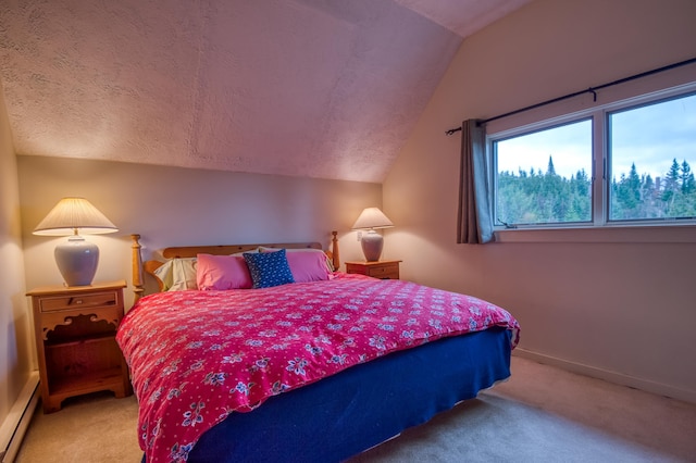 carpeted bedroom with baseboard heating, a textured ceiling, and vaulted ceiling